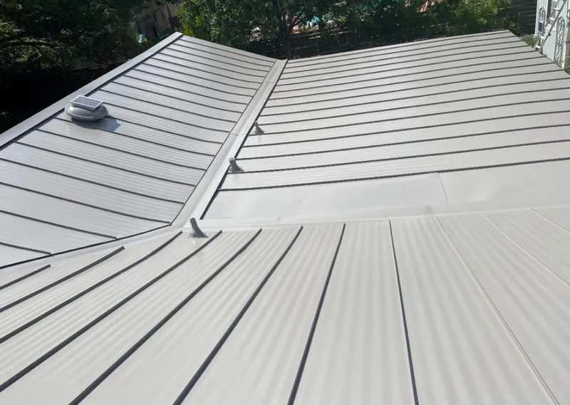 Solar attic fan installed on a metal roof for Roof Ventilation in Grenada